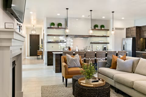 Main floor living room with sofa/chair seating, cable TV, and a fireplace