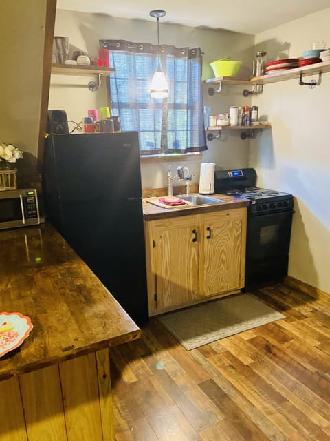 Kitchen - Has plates, cups, utensils, pots/pans, etc.