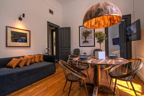 Living room with wooden lamp in the dining table and sofa bed
