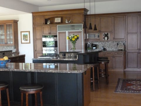 Kitchen showing eating islands and Sub zero fridge