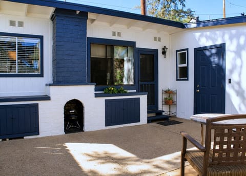 Relax in the courtyard with shaded seating and a concrete floor.