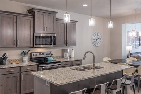 Kitchen - The Kitchen is complete with everything you will need for meal preparations including pots, pans, baking dishes, plates, cups, silverware, cutlery, and an assortment of cooking utensils.