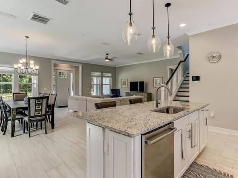 Kitchen island, stainless steel appliances, open layout perfect for families