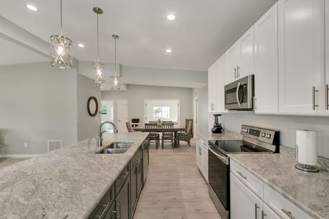 Spacious Granite Island has Lots of Room for Meal Prep.