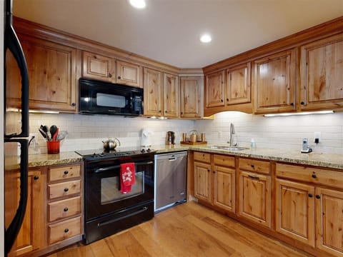Kitchen equipped to prepare a meal or have a cup of coffee. Well stocked 