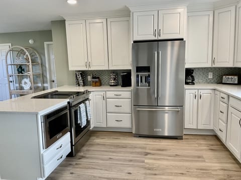 Kitchen with Stainless Refrigerator 
