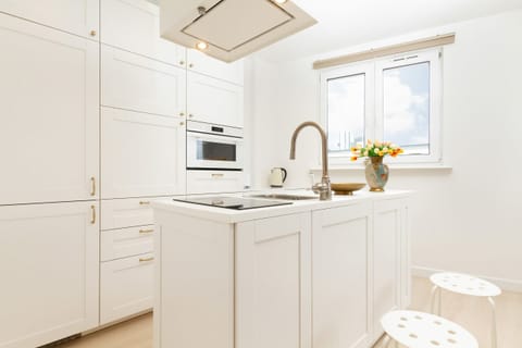 The fully equipped kitchenette includes everything you need for a home-cooked meal.