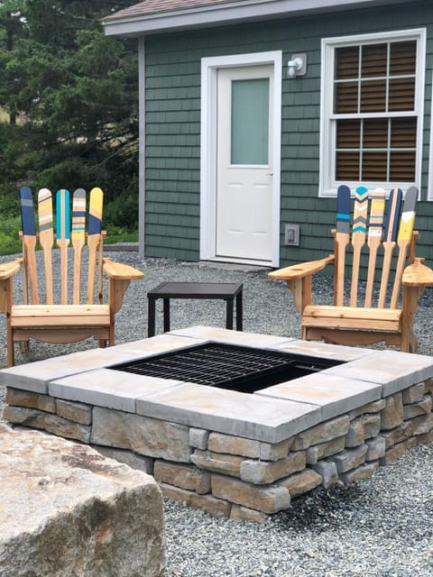 fire pit and Adirondack chairs