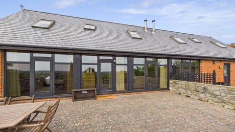 Tithe Barn is an elegant 3-bedroom barn conversion set on a 100-acre working farm in Ashey, near Ryde.