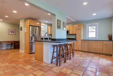 Kitchen with large fridge and wine fridge. Fully stocked to cook and bake