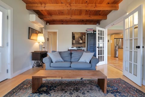 Living room with stereo, CD player, cabinet full of board games, cards
