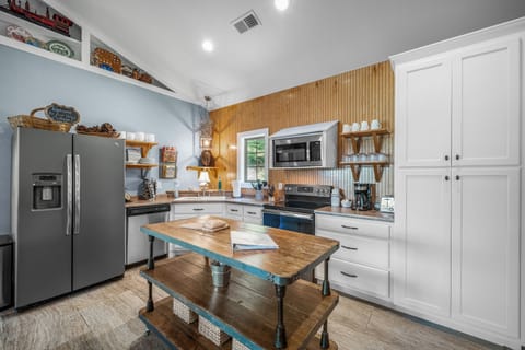 Drip coffee maker. We provide regular ground coffee, sweeteners, & creamer pods.