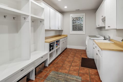 Main floor mud room with storage for every season.