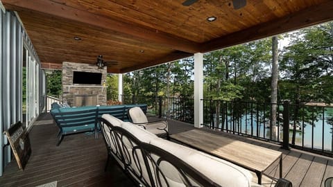 Porch furniture has changed and table with 4 chairs added. 