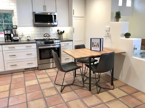 Kitchen table. Extra folding chair is in closet.