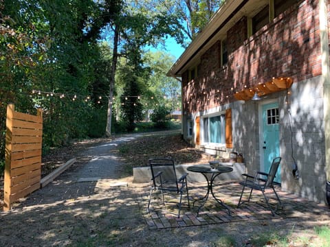 Private suite entrance / terrace nestled in a park-like setting.