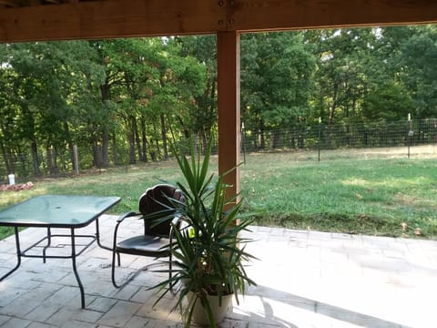 Your private patio with view of the woods. Enjoy listening to the song birds