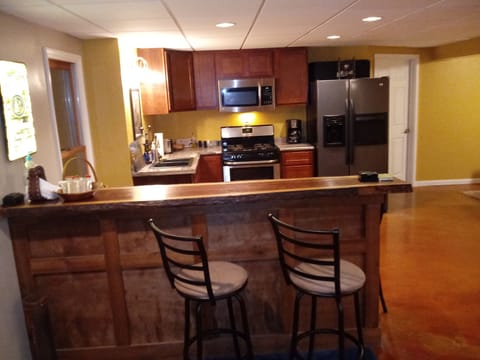 Bar counter at Kitchen. Stove, microwave, frig, sink & cooking utensils supplied