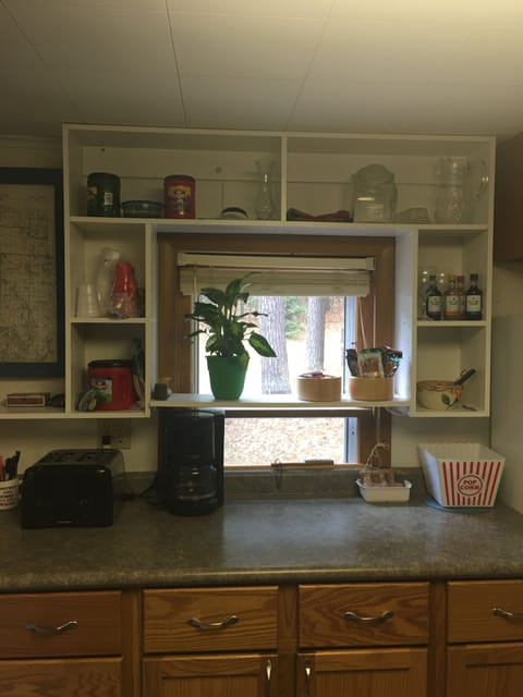 Breakfast area stalked with snacks. Coffee maker and toaster to use.