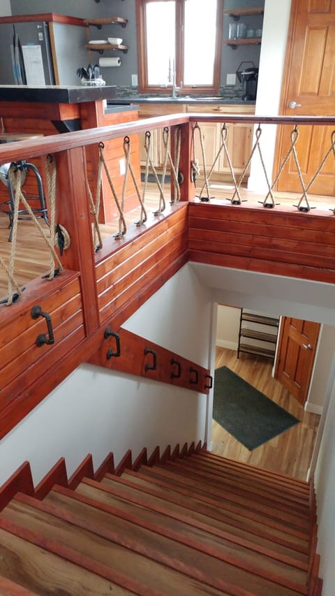 Enter on the ground floor, this unique staircase leads to the main level.