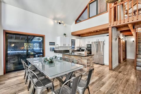 Dining room and fully renovated kitchen featuring high-end amenities and everything you need for a seamless stay.