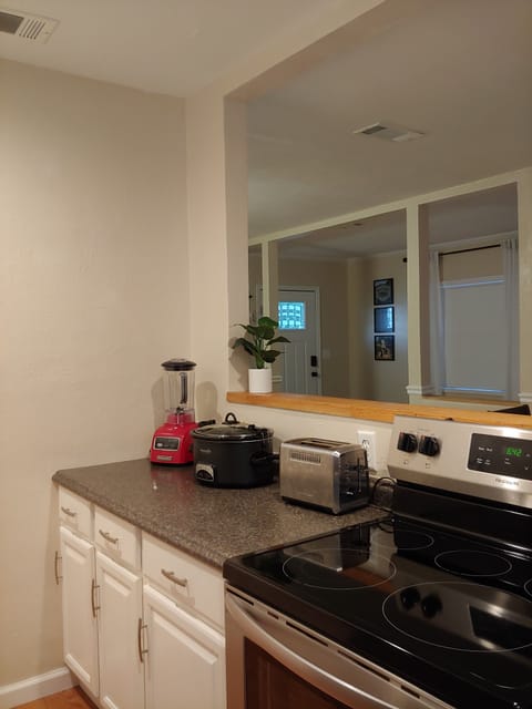 Kitchen is equipped with toaster, waffle maker, crockpot, instapot, blender