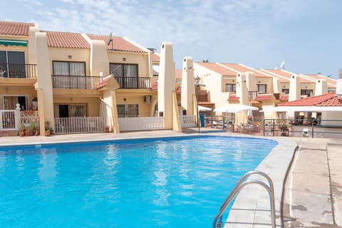 View of communal heated pool and bar / restaurant