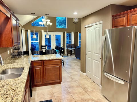View of kitchen and dining area from just inside the front door.