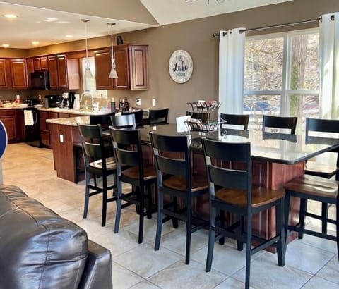 Dining table and kitchen area.