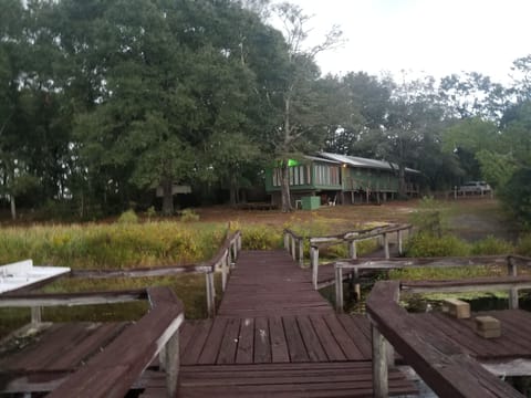 View of cabin from dock; boat ramp is to the right of the dock.