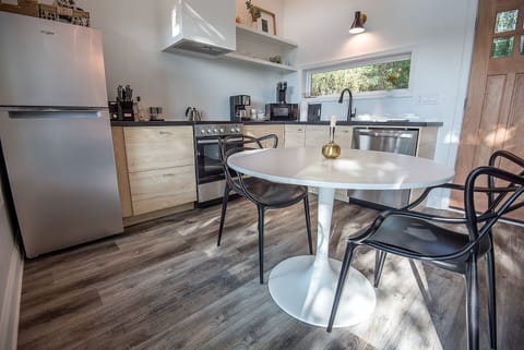 Fully equipped kitchen and dining table for two.