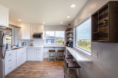 Full size frig, microwave, countertop convection oven, induction cooking plate.