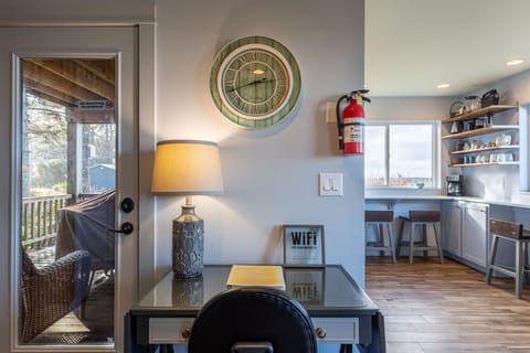 Computer workstation with table, light, rolling chair and free wifi.