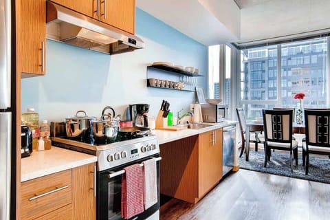 Full size kitchen area with appliances, cookware, dinnerware, utensils, Seattle Coffee, and more more.