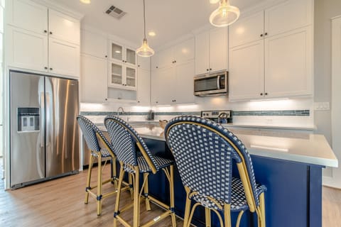 Custom cabinets, stainless appliances, comes stocked w/ cookware and dining ware