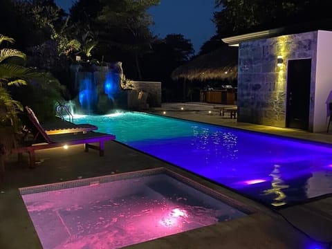 Hydro massage Jacuzzi, waterfall and slide in the background