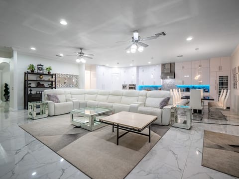 Brand new white leather reclining couches with seating for 11