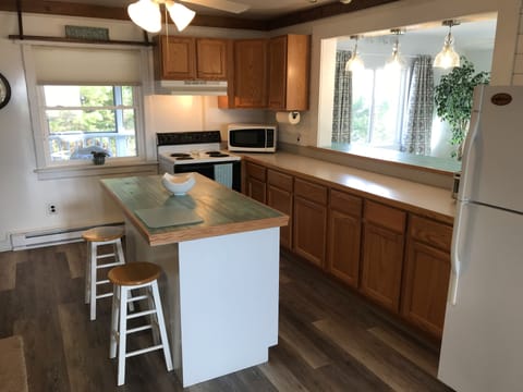 Kitchen with island, kitchen bar for additional dine-in seating.