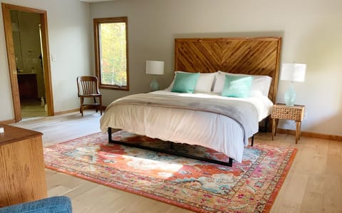 Master bedroom with separate sitting area / recliner, view of waterfall