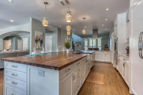 Fully Equipped Gourmet Kitchen with an Expansive Center Island and Side Kitchen Bar, Both with Seating - Great for Entertaining and Meal Prep