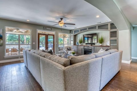 Large Sectional Sofa that Surrounds Gas Fireplace, a 65" Smart TV with Premium DirecTV Channels, including the NFL Package, Sonos Soundbar, DVD, Apple TV and Xbox One