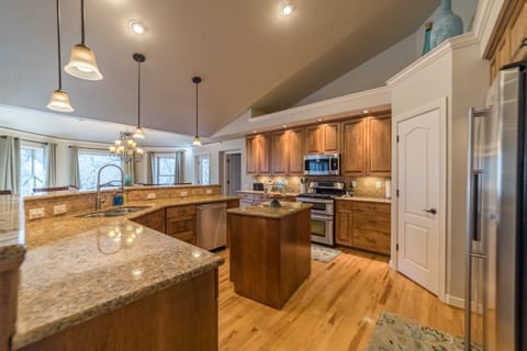 Kitchen with open concept to dining and living rooms 