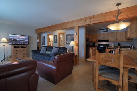 Settle into your cozy mountain retreat where rustic wood beams meet modern comfort. Unwind on plush leather seating while the full kitchen awaits your culinary adventures.