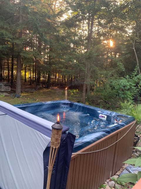 Year-round hot tub looking out into pine woods! 