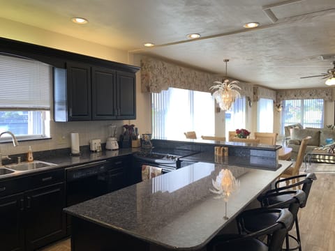 Open Kitchen over Looking the Dinning and Living Room.