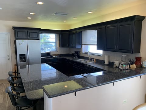 Spacious Kitchen with seating at the bar area.