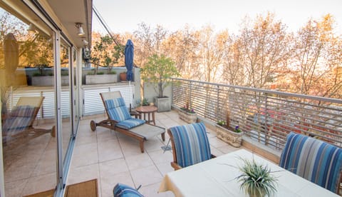 Wonderful morning terrace with Soho treetop view.  Washer/dryer is in cabinet