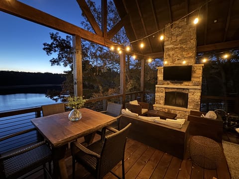 Fireplace and Sunbrite outdoor tv overlooking the lake