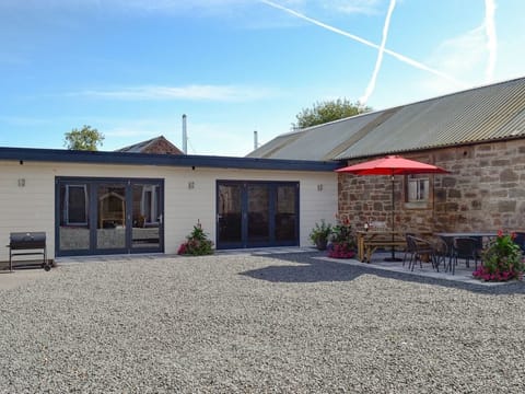Heated games/cinema room with bi-fold doors.