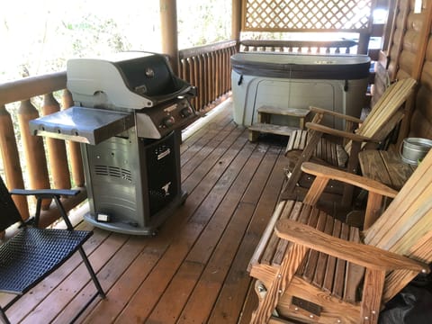 Back patio with gas grill, rocking chairs and hot tub!